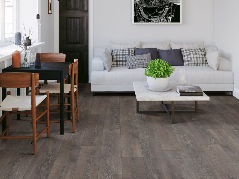 Living room with wood floor white couch desk and coffee table